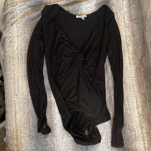 Black Charlotte Russe bodysuit size medium. Good condition. Deep v neck.